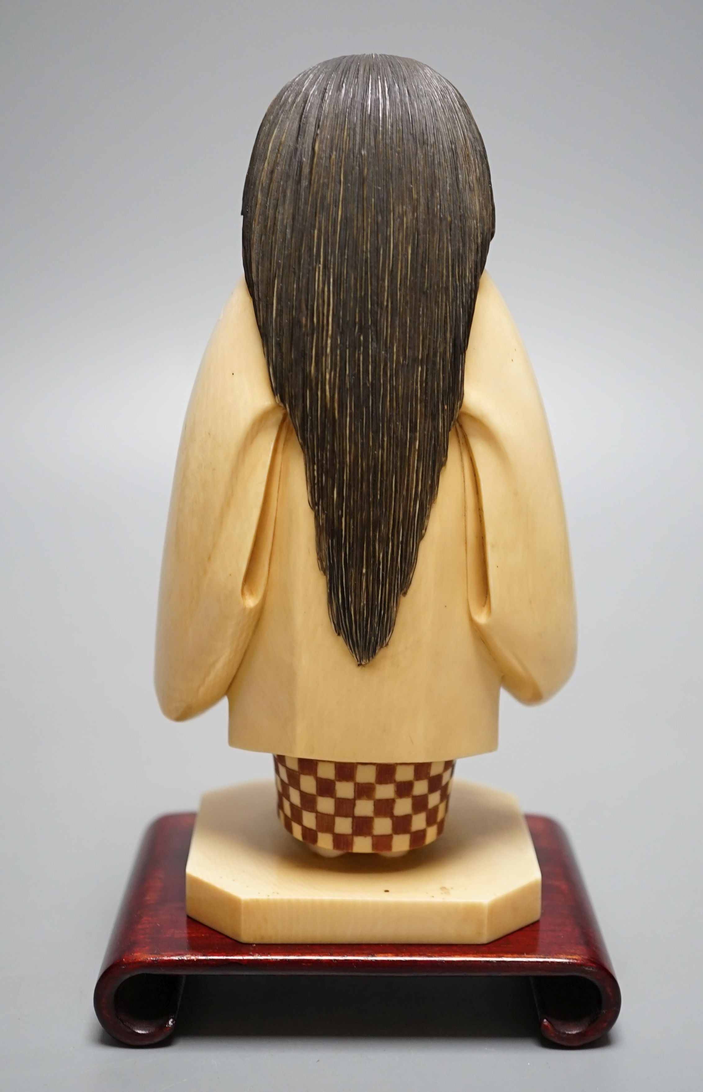 A Japanese ivory figure of a priest, Taisho/early Showa period, signed to a lacquer tablet - 17cm tall